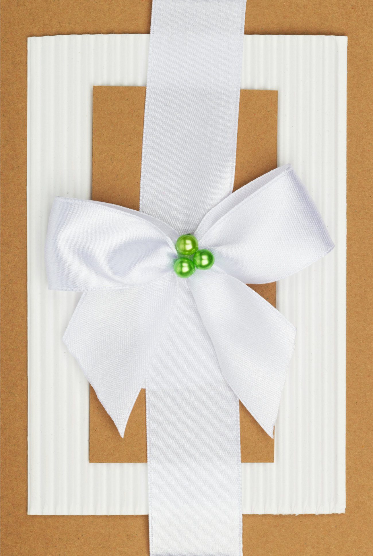 handmade card example with ribbon and bow on top.